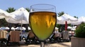 Smartphone Put Into Glass Of Beer And Drowns At Tropic Resort. Slow Motion