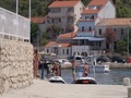 Taxi Boat With Passengers Sailing Into Harbor Tovarnele, Croatia