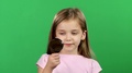 Child Is Holding A Magnifying Glass. Green Screen