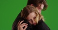 Close Up Of Young Male And Female Caught In Tender Embrace On Green Screen