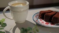 Brownie And Tea With Lemon On A Gray Table