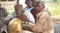 Man Plays Kora For Religious Ceremony To Kill Cow - Guinea, Africa