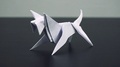 Closeup On A White Origami Dog On A Table
