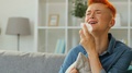 Portrait Of Sad Red Hair Woman With Napkin In The Hands Crying At Home While