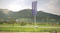European Union Flag With A Highway, Lake And Mountains View.