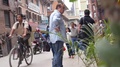 Man Surrounded By People Walking In Street - Handheld