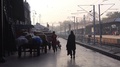 People Walking In Black Light Near Train Station Platform With Birds Flying -