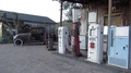 Old Style Gas Pumps And Antique Car At Small Town Arizona General Store