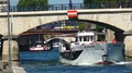 Pond5 Tourist boat under bridge on riverside of seine river in paris, france