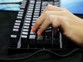 Man Hands Playing On A Gaming Computer Keyboard.