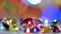 Red Pink And Gold Gems Show On Rotating Platform