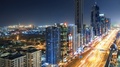 Spectacular Nighttime Skyline Of Dubai With Skyscrapers And Highways