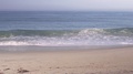 Panning Shot Of The Ocean Waves Crashing On A Beach Shore