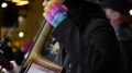 Close Up Of Rainbow Gloved Cello Player Playing 3