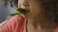 Young Girl Tries Broccoli And Hates It, Children Can't Stand Raw Vegetables