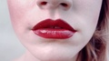 Close-Up Beautiful Chubby Lips With Bright Juicy Red Lipstick.