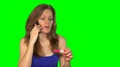 Beautiful Young Woman Talking On Cell Phone And Smiling At Pregnancy Test