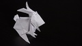 An Origami Rabbit On A Table - Closeup From Above