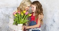 Mother Gets A Bouquet Of Colorful Flowers From Her Daughter On Mothers Day