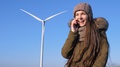 Mobile Communication, Happy Girl Talking On Cell Phone Beside Wind Power