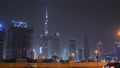 Panorama Of Night Dubai With Traffic And Skyscrapers. City Center.