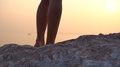 Close-Up. A Brown Dress Develops In The Wind Against The Sunset. Slow Motion