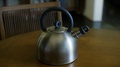 Slow Motion Video Of Camera Circling Black Handled Stainless Steel Kettle Sat
