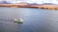 Fishing Boat Heading Out To Pick Up Lobster Pots. Drone Shot. 4k.