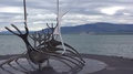 A Sculpture Of A Viking Ship Stands At Reykjavik Iceland Harbor, With Cruise