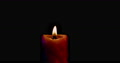 Single Candle On Black Background Under Red Blue Lights With Blow Out