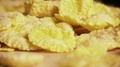Slow Corn Flakes Are Falling On The Table Close-Up