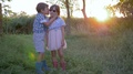 Friendship, Boy Whispering Secret Into Ear Of Child Girl On Background Sunset