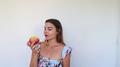 Beautiful Girl Looking Like Snow Whte Bites Apple In Slow Motion