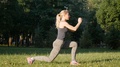Beautiful Girl Is Doing Exercises In The Park