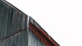 Icicles Dripping Water Off The Edge Of A Canadian Metal Barn Roof