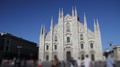 Milan, Duomo Dome Cathedral With Blurred People Walking By