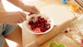 Closeup 4k Footage Of Young Woman Mixing And Preparing Sweet Cherry Filling For