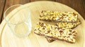 Granola Bars With Milk On Wooden Background