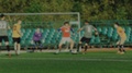 Soccer Player Attacks And Goalkeeper Catches A Ball, Football Game, Blurred For