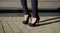 Close-Up Shot Of A Woman's Sexy Legs In Black Jeans And On High Heels, Fit Legs.