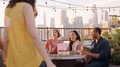 Friends Gathered On Rooftop Terrace To Celebrate Birthday With City Skyline In