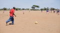 Kenya, Kisumu - May 20, 2017: Happy African Children And Teacher Plying Football