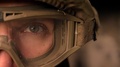 Close-Up Focused Eye Of Strong Military Man In Uniform And Helmet, Looking At