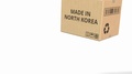 Falling Carton With Made In North Korea Text, 3d Animation