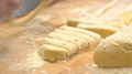 Human Hands Make And Modelling Piece Of Pasta (Made With Flour Eggs And