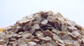 Rolled Oats Grains Close Up. Rotation Oat Flakes Background, Macro, Top View