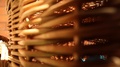 Close Up View Of Modern Straw Basket With Warm Summer Sunshine On Blur