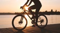 Pond5 Woman riding bicycle at sunset, silhouette, slow motion footage