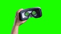 Left Hand Coming Out With Vr Device In Front Of Green Screen