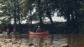 A Canoeing Lesson Taking Place On A River